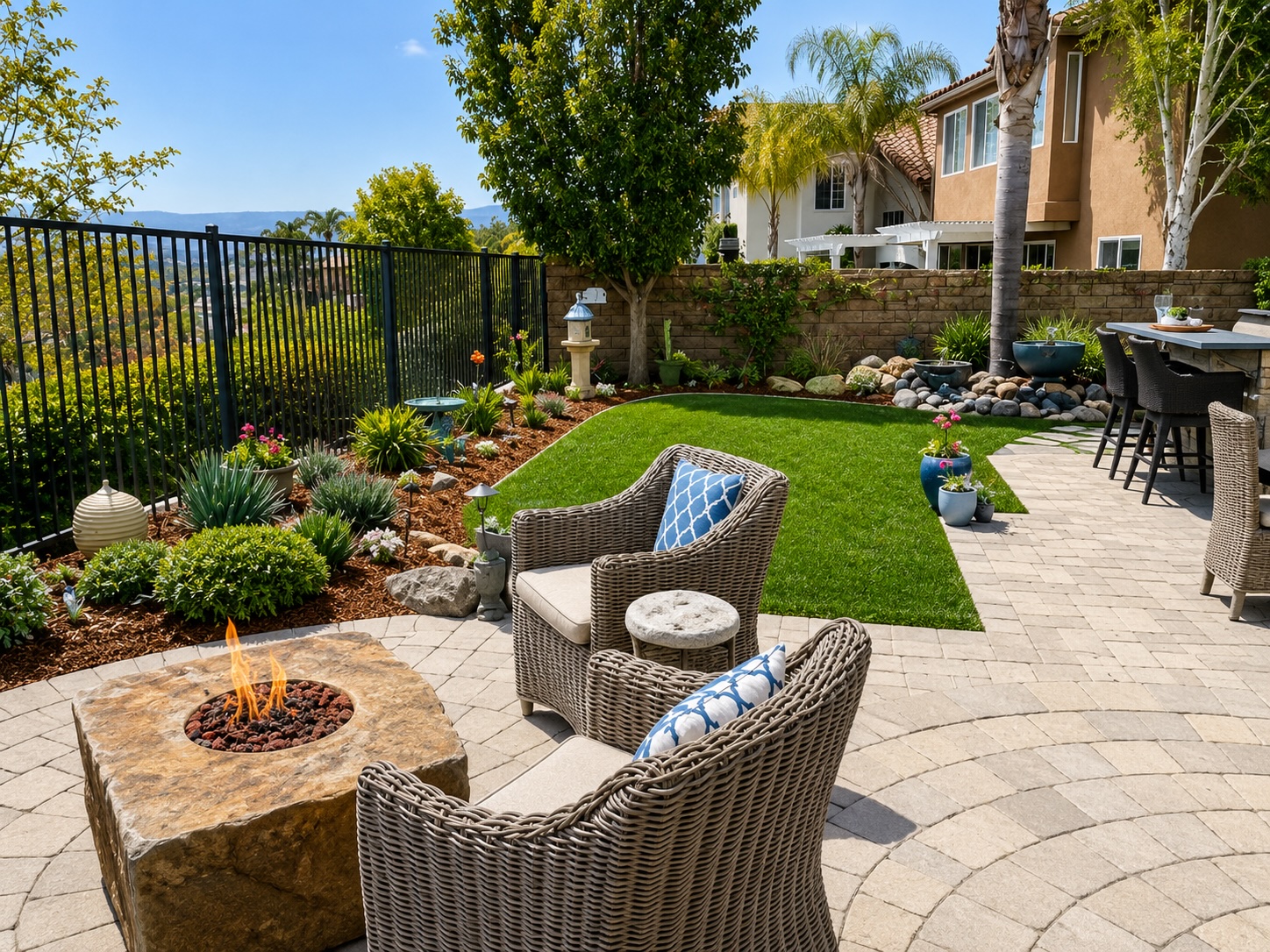 Firescape Landscape Design in Simi Valley Modern firescape landscape design with fire feature, paver patio, drought-tolerant landscaping, and outdoor living space in Simi Valley
